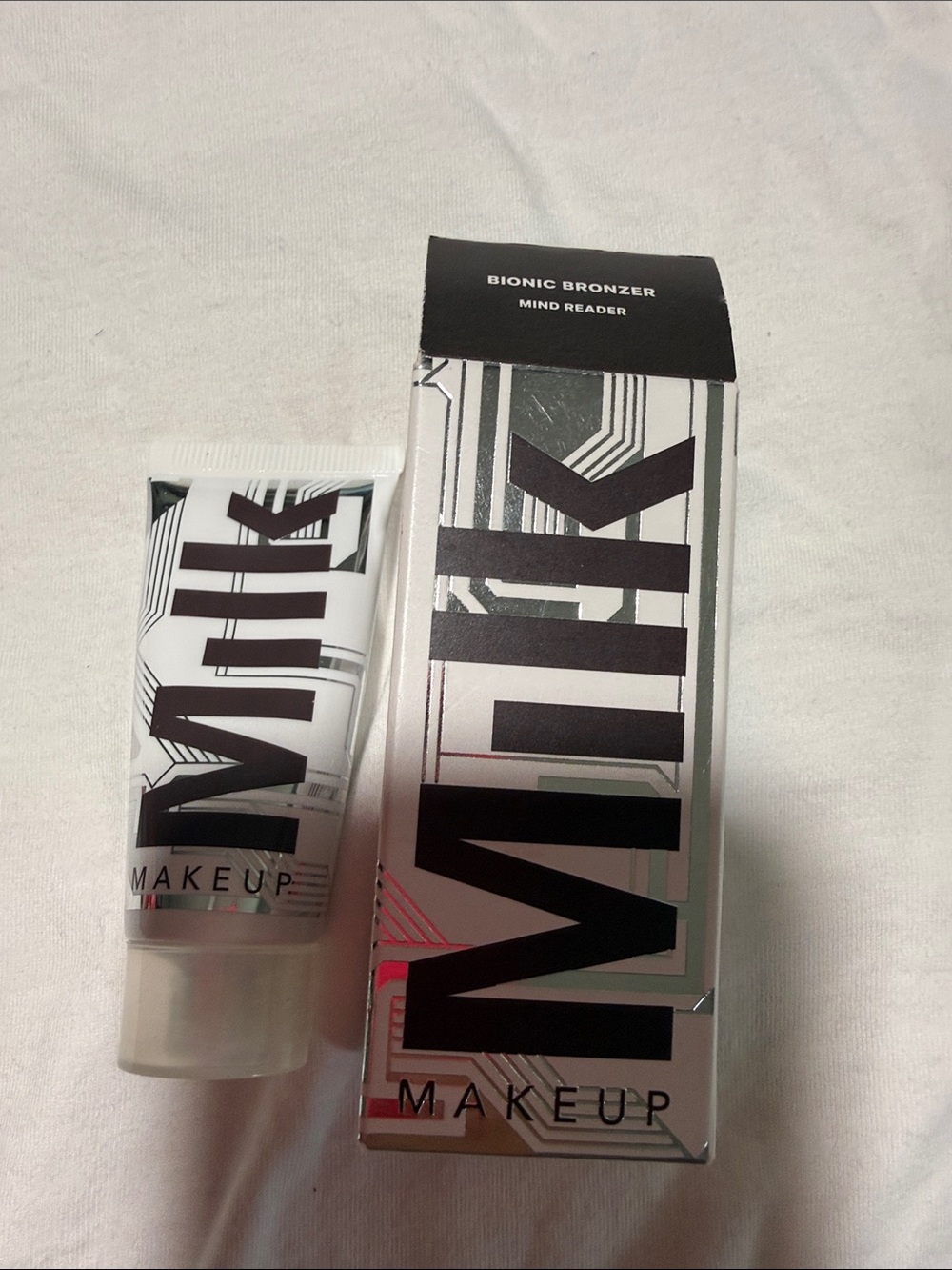 Milk Makeup Bionic Bronzer Tube and Box — White and Black Accents